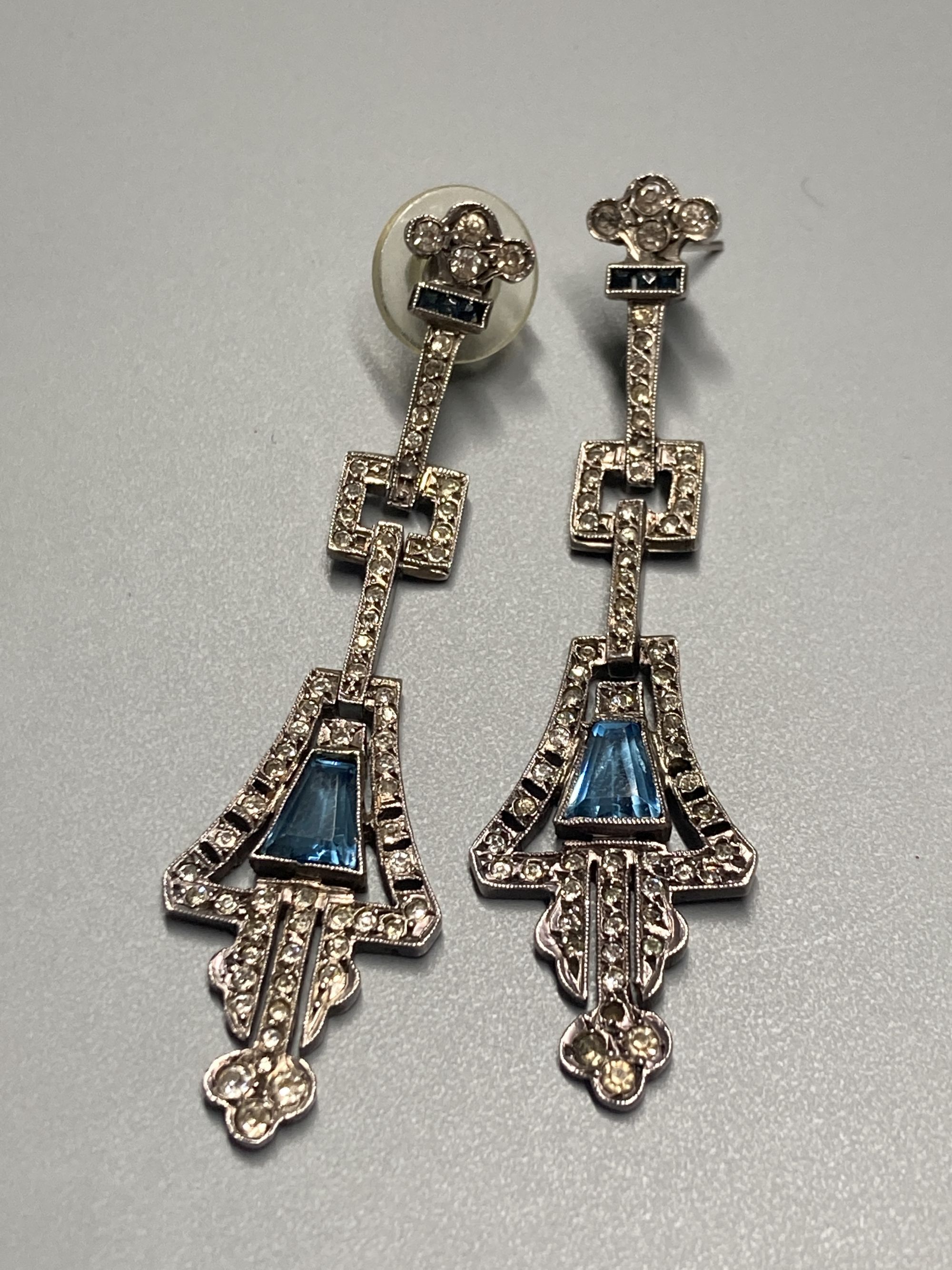 A pair of 1920s/1930s French white metal, white and blue paste set drop earrings, 61mm.